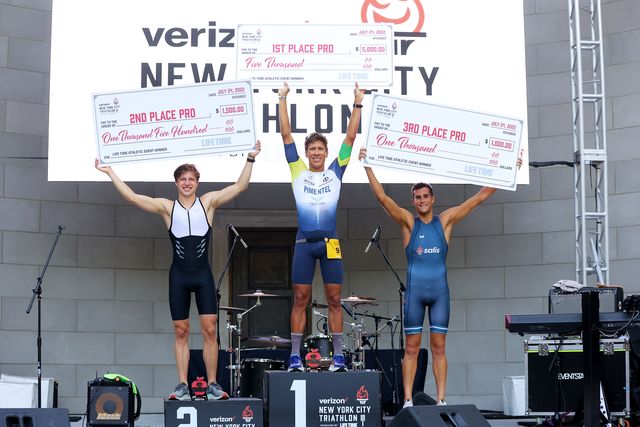 Andy Krueger, Danilo Pimentel and Alejandro Canas pose for a photo following the New York City Triathlon.